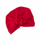 Red turban with a knot on a white background