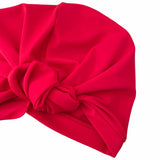 Red headscarf with a large bow on a white background