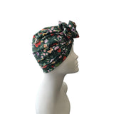 Floral patterned headscarf on a mannequin head against a white background
