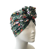 Floral patterned head wrap on a mannequin head against a white background