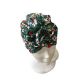 Floral patterned head wrap on a mannequin head against a white background