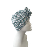 Turban with a pattern on a mannequin head against a white background