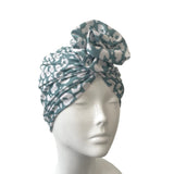 Turban with animal pattern on a mannequin head against a white background