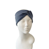 Gray headband on a mannequin head against a white background
