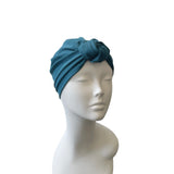 Blue headscarf on a mannequin head against a white background