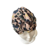 Camouflage-patterned headscarf on a mannequin head against a white background
