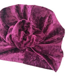 Purple velvet turban on a white background