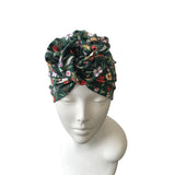 Floral patterned headscarf on a mannequin head against a white background