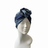 Navy and gray headscarf on a mannequin head against a white background