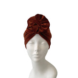 rust headscarf on a mannequin head against a white background