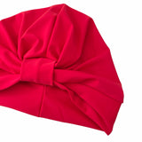 Red headscarf with a large bow on a white background