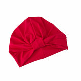 Red turban with a knot on a white background