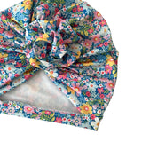 Floral headscarf with a knot on a white background