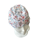 Floral patterned headscarf on a mannequin head against a white background