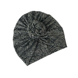 Zebra patterned turban on a white background