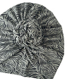 Zebra patterned headscarf on a white background