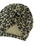 Leopard print headscarf with a knot on a white background