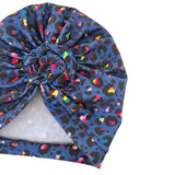 Colorful patterned head wrap on a white background