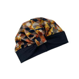 Colorful geometric-patterned headscarf with black base on a white background