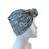 Blue headscarf with floral pattern on a mannequin head against a white background ireland