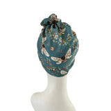 Decorative drawstring bag with floral and insect pattern on a white background