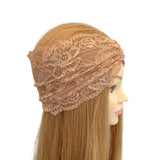 Beige lace headband on a mannequin head with long blonde hair against a white background