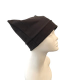 Black beanie on a mannequin head against a white background