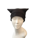 Black cat ear hat on a mannequin head against a white background