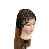 Black lace bonnet on a mannequin head with brown hair against a white background