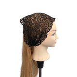 Black lace head covering on a mannequin head with blonde hair.