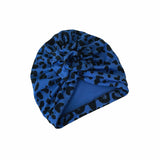 Blue turban with black pattern on a white background