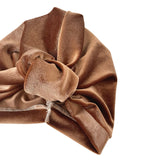 Brown velvet turban on a white background