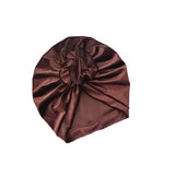 Brown satin turban on a white background