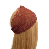 Brown lace headband on a mannequin head with blonde hair against a white background