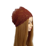 Brown lace headband on a mannequin head with long brown hair against a white background