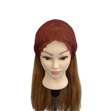 Mannequin head with a brown lace headband on a white background