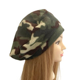 Camouflage-patterned headscarf on a mannequin head against a white background