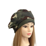 Camouflage beanie on a mannequin head with long hair against a white background