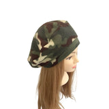 Camouflage-patterned beanie on a mannequin head against a white background