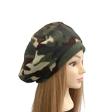 Camouflage-patterned beanie on a mannequin head against a white background