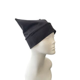Black beanie on a mannequin head against a white background