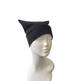 Black beanie on a mannequin head against a white background