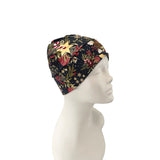 Floral-patterned headscarf on a mannequin head against a white background