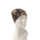 Floral patterned headscarf on a mannequin head against a white background