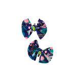 Two colorful floral bows on a white background