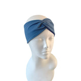 Blue headband on a mannequin head against a white background