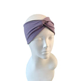 Purple headband on a mannequin head against a white background