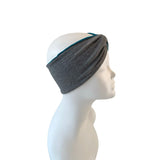 Gray headband on a mannequin head against a white background