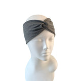 Gray headband on a mannequin head against a white background