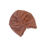 Brown ribbed knit turban on a white background